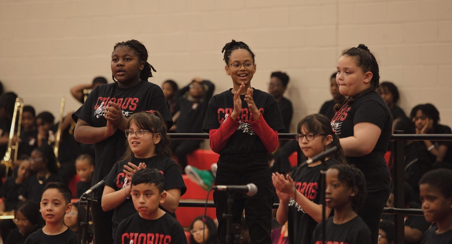 Chorus members performing